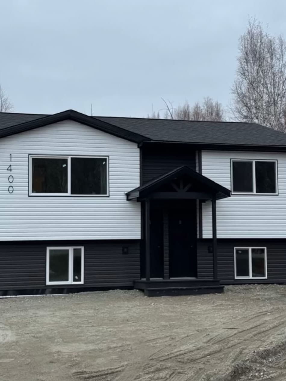 House after Golden Hammer renovation — fully renovated exterior with new roof and siding